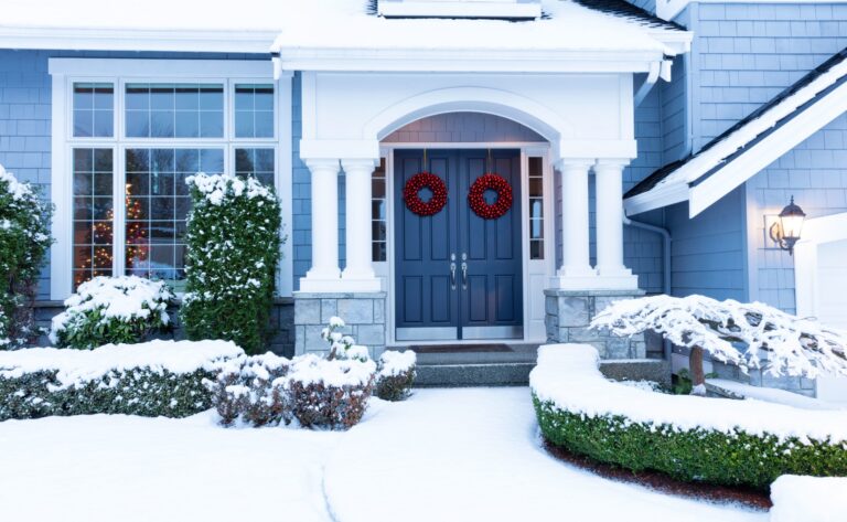 snow covered home with replacement windows